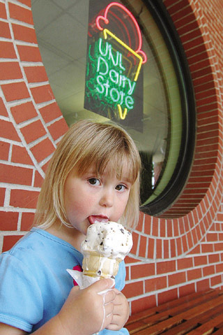 Norah Blow of Lincoln tries to eat her chocolate chip ice cream cone before it melts July 9 at UNLs...