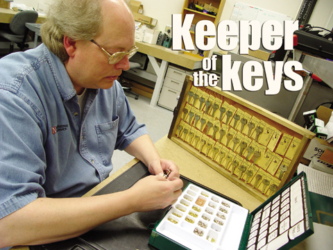 Kim Kramer, a trade supervisor for facilities management and planning at UNL, places pins in a lock. Kramer, who also...