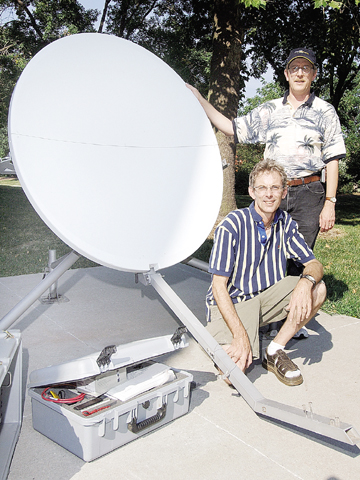 Mark Hendricks, left, of Communications and Information Technology, and Cliff Ritz of Information Services pose with communications equipment. Hendricks and...