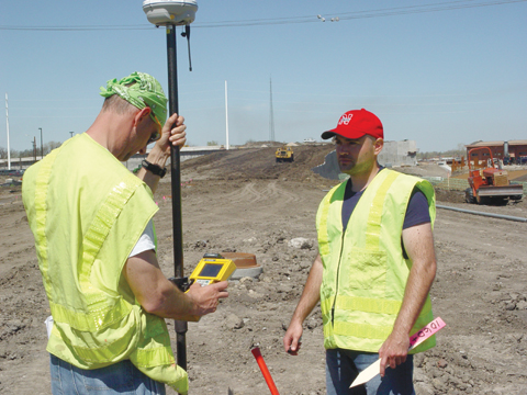 BIG T SURVEY - Don Bosak (left) and Mark Schmit of Speece-Lewis Engineers conduct a site survey April 12 on the...