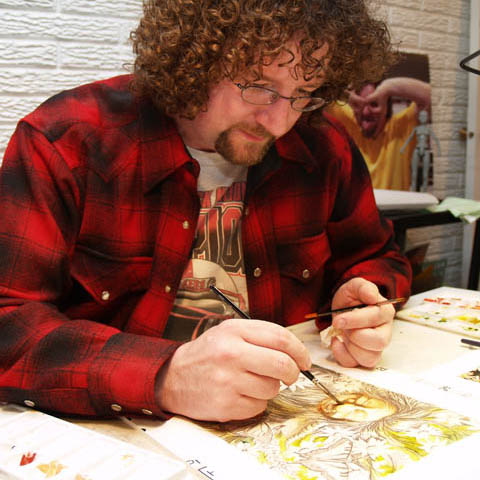 BUILDING UP - Mike Jackson, an illustrator in the Instructional Design Center, applies watercolor to an underdrawing of 