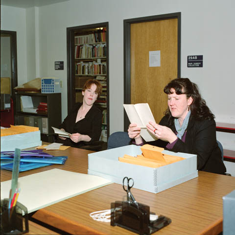 INITIAL REVIEW - University archivists Carmella Orosco (left) and Mary Ellen Ducey read letters from the newly donated Roscoe and Meta...