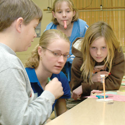 SCIENCE SATURDAY - UNL undergraduate Ann Langemeier (second from left) helps Lincoln Public Schools students (clockwise, from far left) Ben Hartzell...