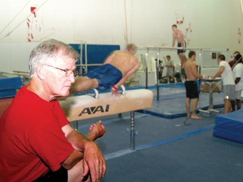 DEDICATED COACH - Husker men's gymnastics coach Francis Allen watches a routine during an Aug. 9 practice. Allen - who was a...