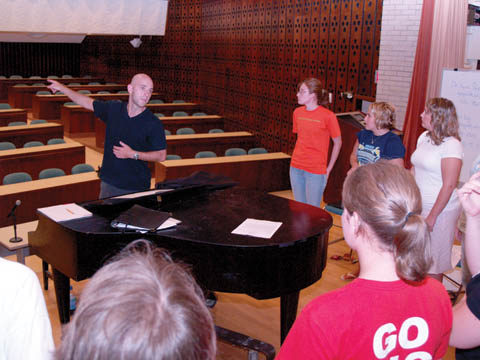 WAY BACK - James Wilson, UNL graduate student and director of the East Campus Choir, tells choir members to sing loud...