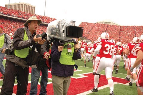 GAME DAY SHOOT - Members of a Warner Brothers Pictures film crew shoot the tunnel walk during the Oct. 13 Husker...