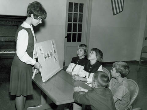 SPEECH LESSON - An unidentified Teachers College undergraduate works with students in this photo from the 1950s.