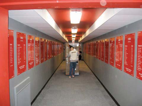 A Von Rentzell employee pushes a rack down the South Stadium hallway that was previously used for the Husker football...