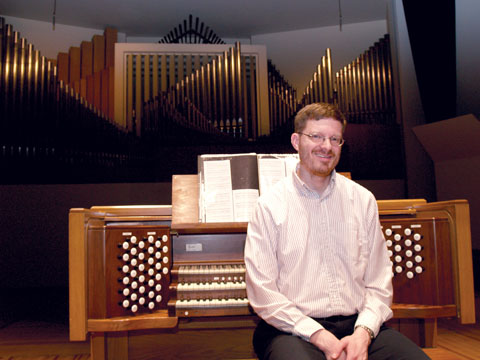 FEATURED PLAYER - Christopher Marks sits at the organ in Kimball Recital Hall. Marks will celebrate the release of his CD...