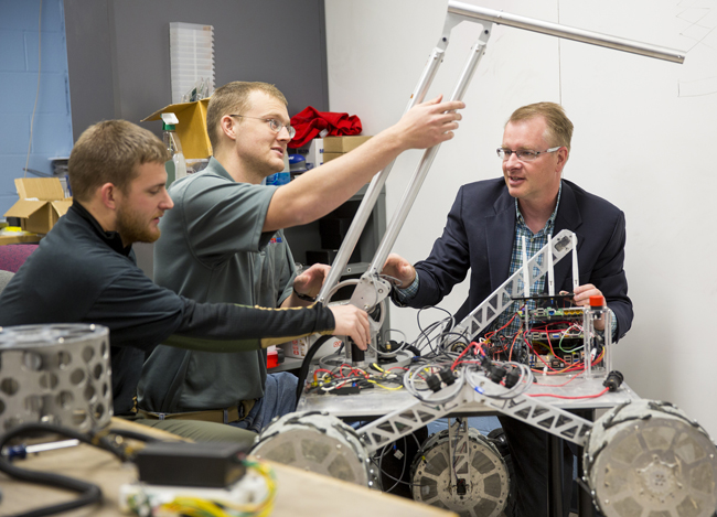 Shane Farritor (right), professor of mechanical engineering, has earned the Innovation, Development and Engagement Award for his collaboration with Dmitry Oleynkiv, a professor of surgery at UNMC.